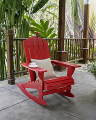 The red wood rocky chair in the backyard. 