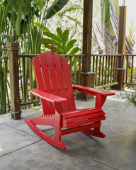 The red wood rocky chair in the backyard. 