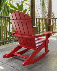 The red wood rocky chair in the backyard. 