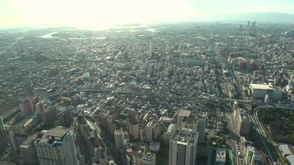 OSAKA, JAPAN - CIRCA SEPTEMBER 2019 : Aerial high angle view of CITYSCAPE of OSAKA in early evening sunset time. Osaka is the second largest metropolitan area in Japan.