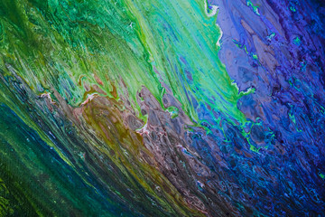 Abstract Oil color paint splatter on ground.