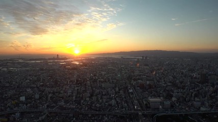 OSAKA, JAPAN - CIRCA SEPTEMBER 2019 : Aerial high angle view of CITYSCAPE of OSAKA in early evening sunset time. Osaka is the second largest metropolitan area in Japan.