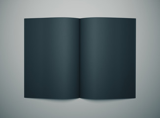 black notepad on gray desktop