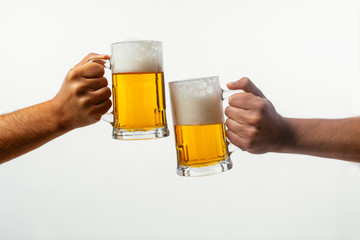 Hands toasting with beer on white background