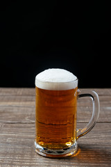 Beer mug on black background