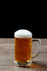 Beer mug on black background