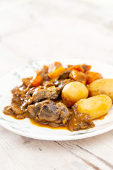 Beef meat stewed with potatoes-Traditional French cuisine Beef Bourguignon potatoes carrots in persillade