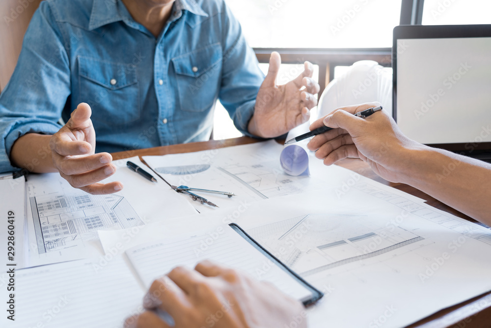 Poster architects engineer discussing at the table with blueprint, teamwork and work flow construction conc