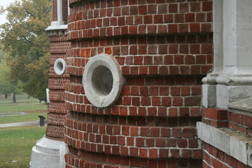 round window on a brick tower