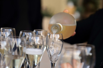 Glass glasses with prosecco - setting up the glasses on the table in the restaurant for an aperitif