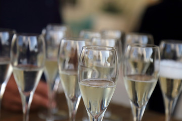 Glass glasses with prosecco - setting up the glasses on the table in the restaurant for an aperitif