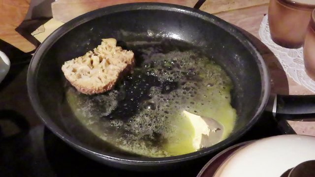 cauliflower fungus (Sparassis crispa). roast mushroom in pan with butter.