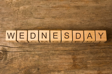 wednesday word written on wooden cubes on wooden background
