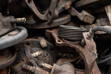 Old engine parts, steel and used car parts, for engineering. Selective focus.