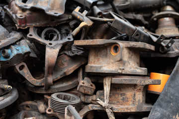 Old engine parts, steel and used car parts, for engineering. Selective focus.