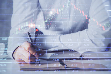 Financial trading chart multi exposure with man desktop background.