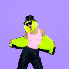 Fashion hipster girl. Clubbing style. Street swag outfit. Neon power