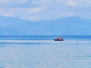 Boat with tourists on the blue Ohrid lake