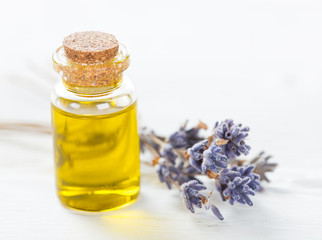 Wellness treatments with lavender flowers on wooden table. Spa still-life.