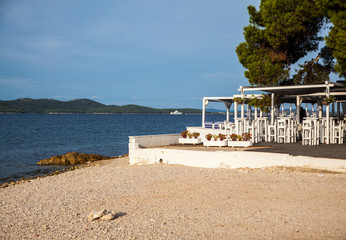 beach with chairs and umbrellas