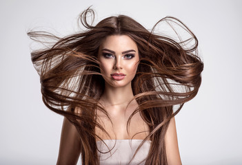 Portrait of a beautiful woman with a long hair.
