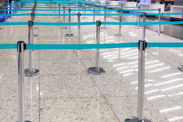 Blue restrictive ribbons for passengers at a modern airport