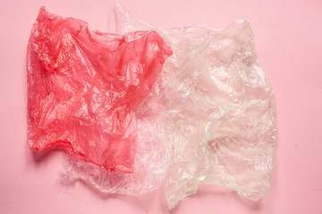 Environmental issues and environmental protection. disposable plastic bags on pink background