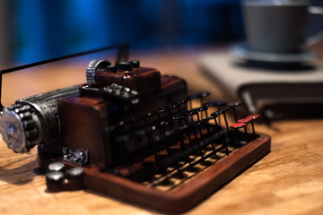 Obraz na płótnie Canvas typewriter with a cup of coffee