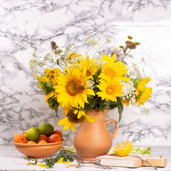 Bouquet of beautiful sunflowers in a jug