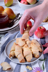 Shortbread rolled cookies with apple and pear jam filling