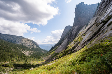 Fototapeta premium Gorgeous panoramic view on top of western Sayan mountain range in Ergaki national park, Siberia, Russia