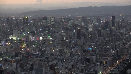 OSAKA, JAPAN - CIRCA SEPTEMBER 2019 : Aerial high angle view of CITYSCAPE of OSAKA in early evening sunset time. Osaka is the second largest metropolitan area in Japan.