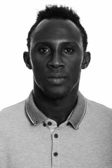 Studio shot of young African man in black and white