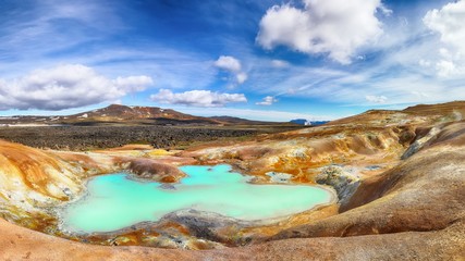 Fototapeta na wymiar Exotic landscape of Acid hot lake with turquoise water in the geothermal valley Leirhnjukur