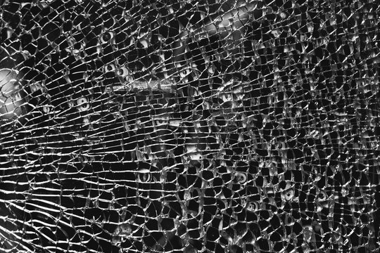 Texture of broken glass with little cracks , abstract black and white background