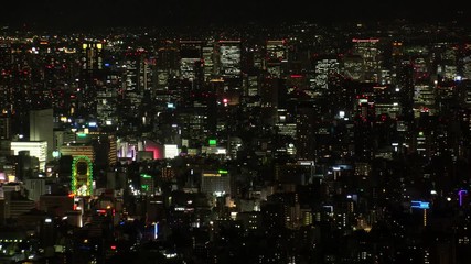 OSAKA, JAPAN - CIRCA SEPTEMBER 2019 : Aerial high angle view of CITYSCAPE of OSAKA in night time. Osaka is the second largest metropolitan area in Japan.