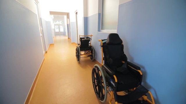 Wheelchairs on the corridor of a medical facility. Elderly care home. Disability