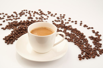 cup of coffee with beans on white background