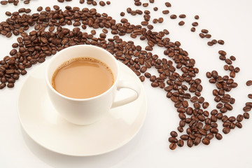 cup of coffee with beans on white background