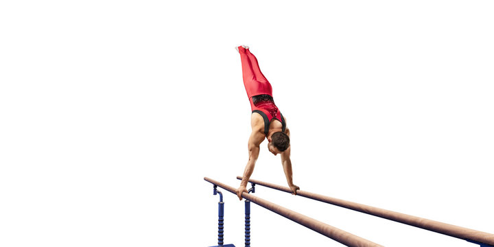 Male athlete doing a complicated exciting trick on parallel bars on white background. Isolated Man perform stunt in bright sports clothes