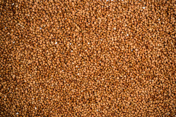 The texture of dry buckwheat. Background image of buckwheat porridge. Maro's Photo
