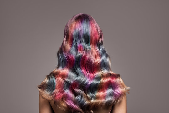 Perfect long wavy colorful hair. View from behind.