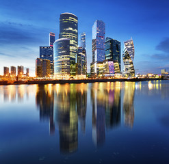 Moscow City skyline.  International Business Centre at night time with Moskva river.