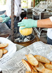 Baked melted cheese called Caciocavallo over the hot coals.