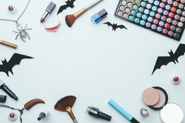 Photo of shadows, brushes, halloween spider, ghost on empty white background.