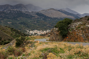 Fototapeta na wymiar Rural narrow road in the mountains (Greece, Crete)