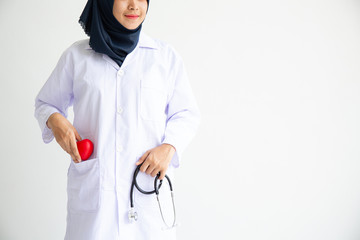 Young Arab Muslim intern doctor women smile on isolate white background concept for Islam people working in medical hospital health care, Modern Nurse wearing hijab in medico clinic business service.