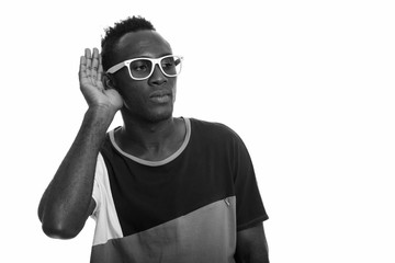 Studio shot of young African man in black and white