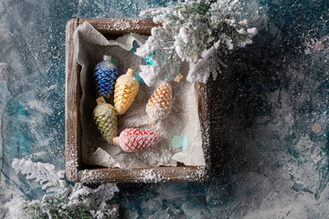 Christmas decorations and snow close-up in wooden crate