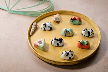 Chocolate candies set on plate, sweet food